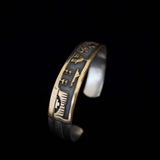 Brazalete navajo de plata de ley y oro FJ Henry Storyteller